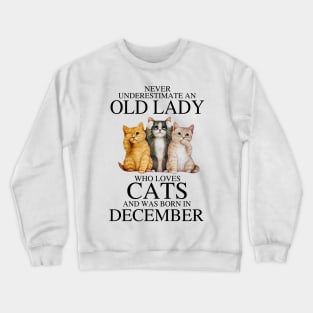 Never Underestimate An Old Lady Who Loves Cats December Crewneck Sweatshirt